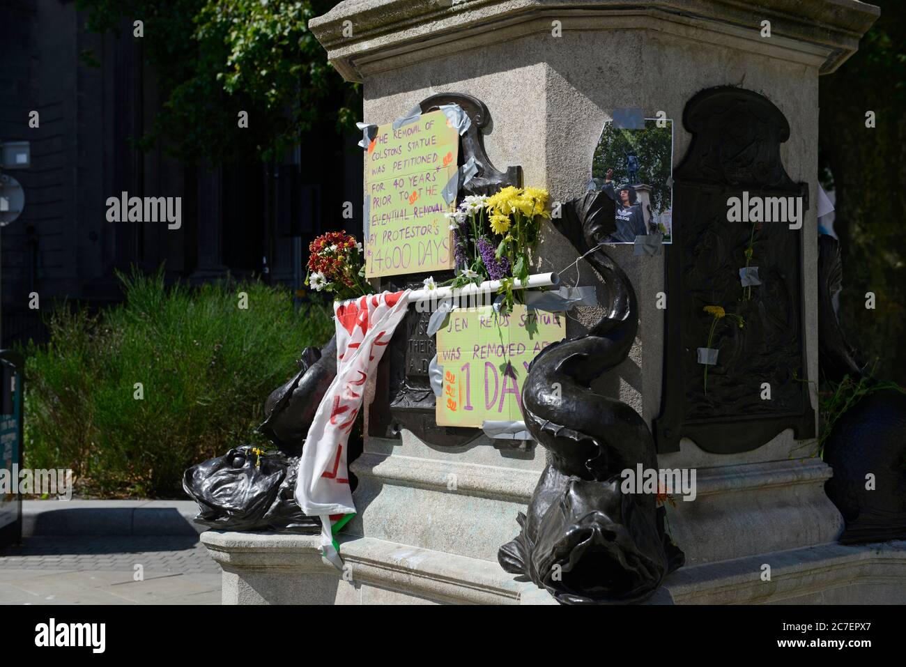 The plinth on which the 'A Surge of Power (Jen Reid)' statue stood  for just one day in July 2020 in Bristol, UK, after removal, with many messages. Stock Photo