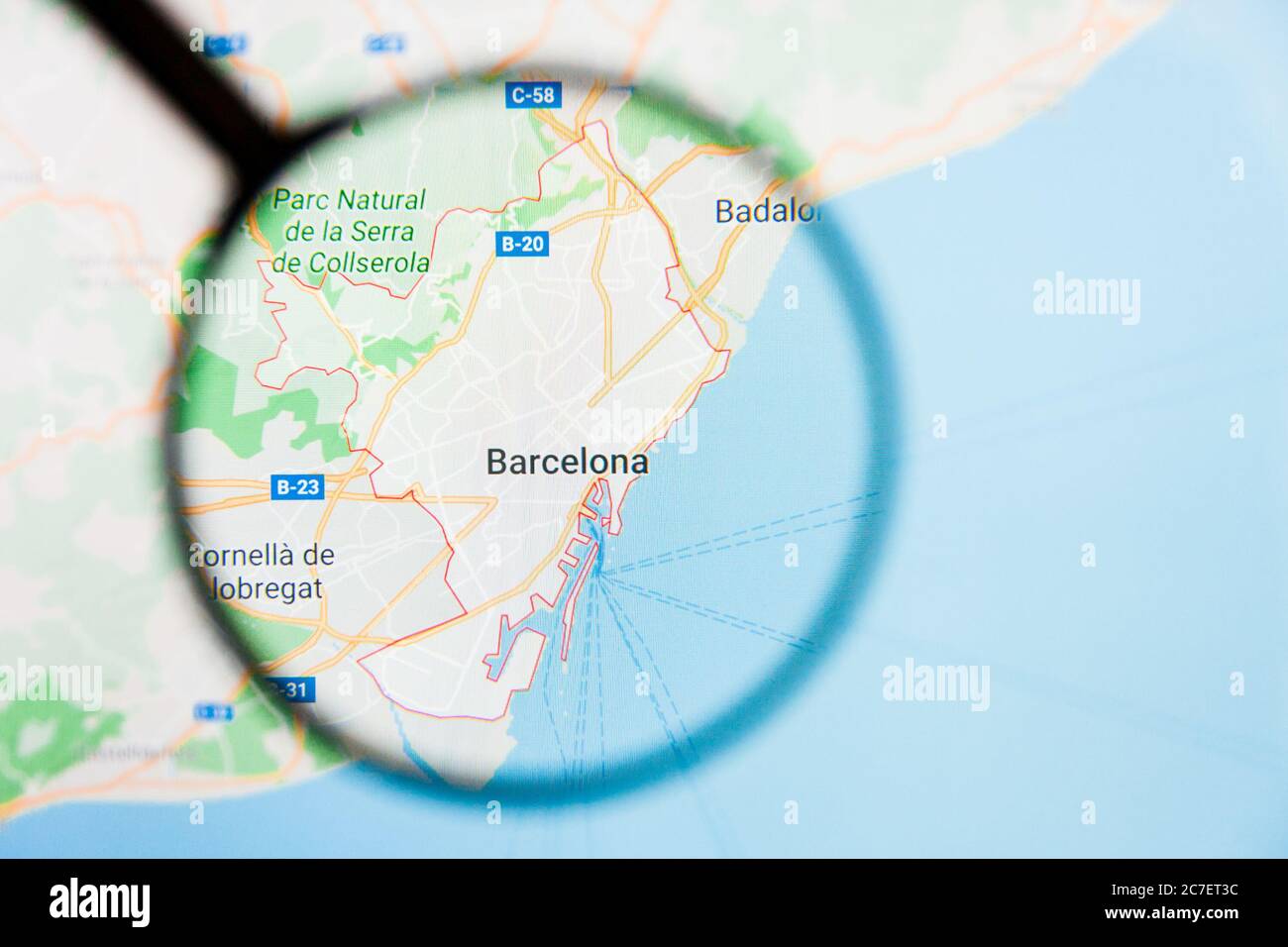 Barcelona city visualization illustrative concept on display screen through magnifying glass Stock Photo