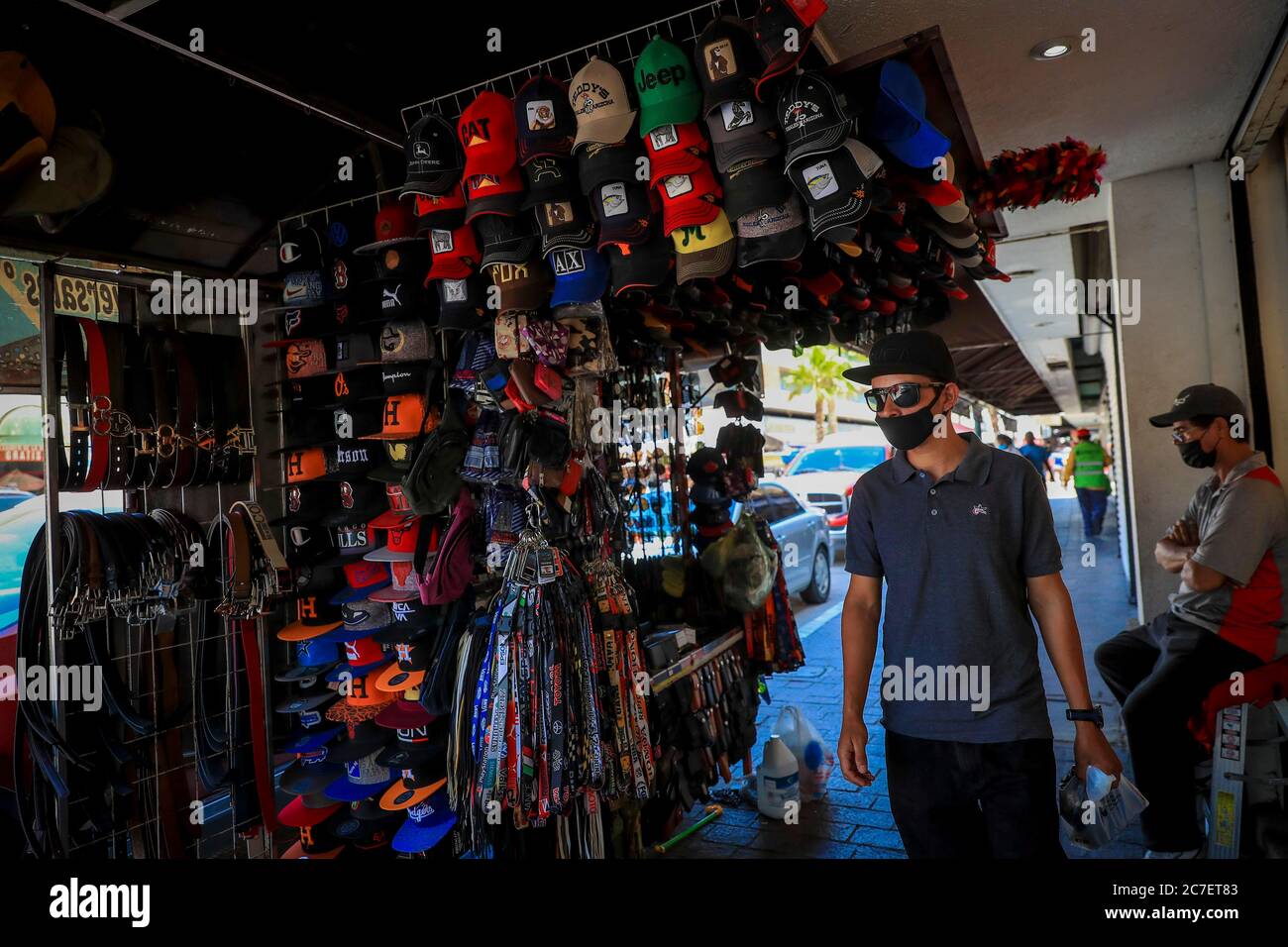 HERMOSILLO, MEXICO - JULY 16 :A man walks the side of a mobile cap trade during the first day of business reopening as the red alert continues in the city for the covid-19 pandemic on July 16, 2020 in Hermosillo, Mexico.(Photo by Luis Gutierrez/ Norte Photo) Stock Photo