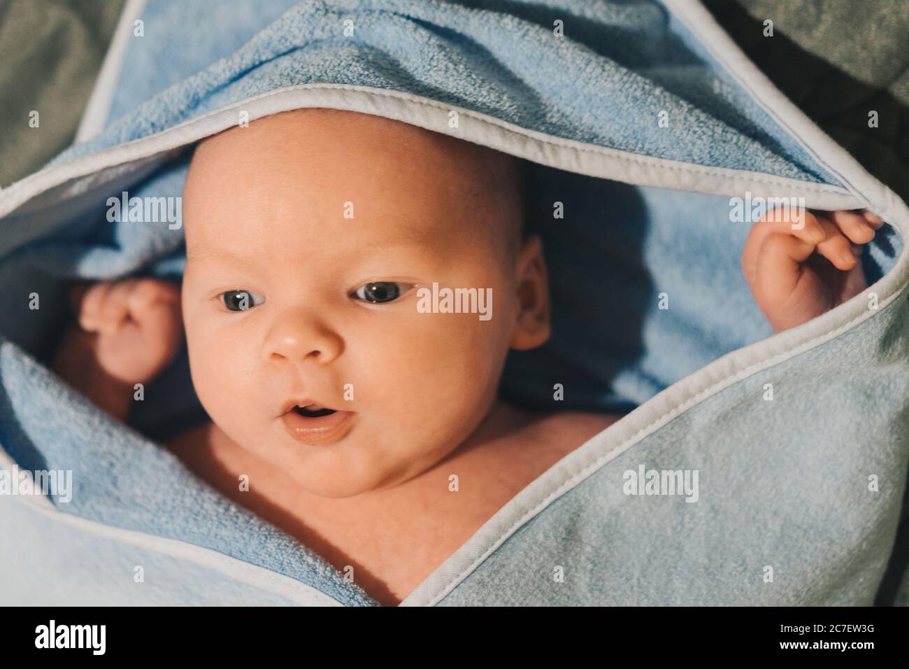 Little baby in towel after bath Stock Photo Alamy