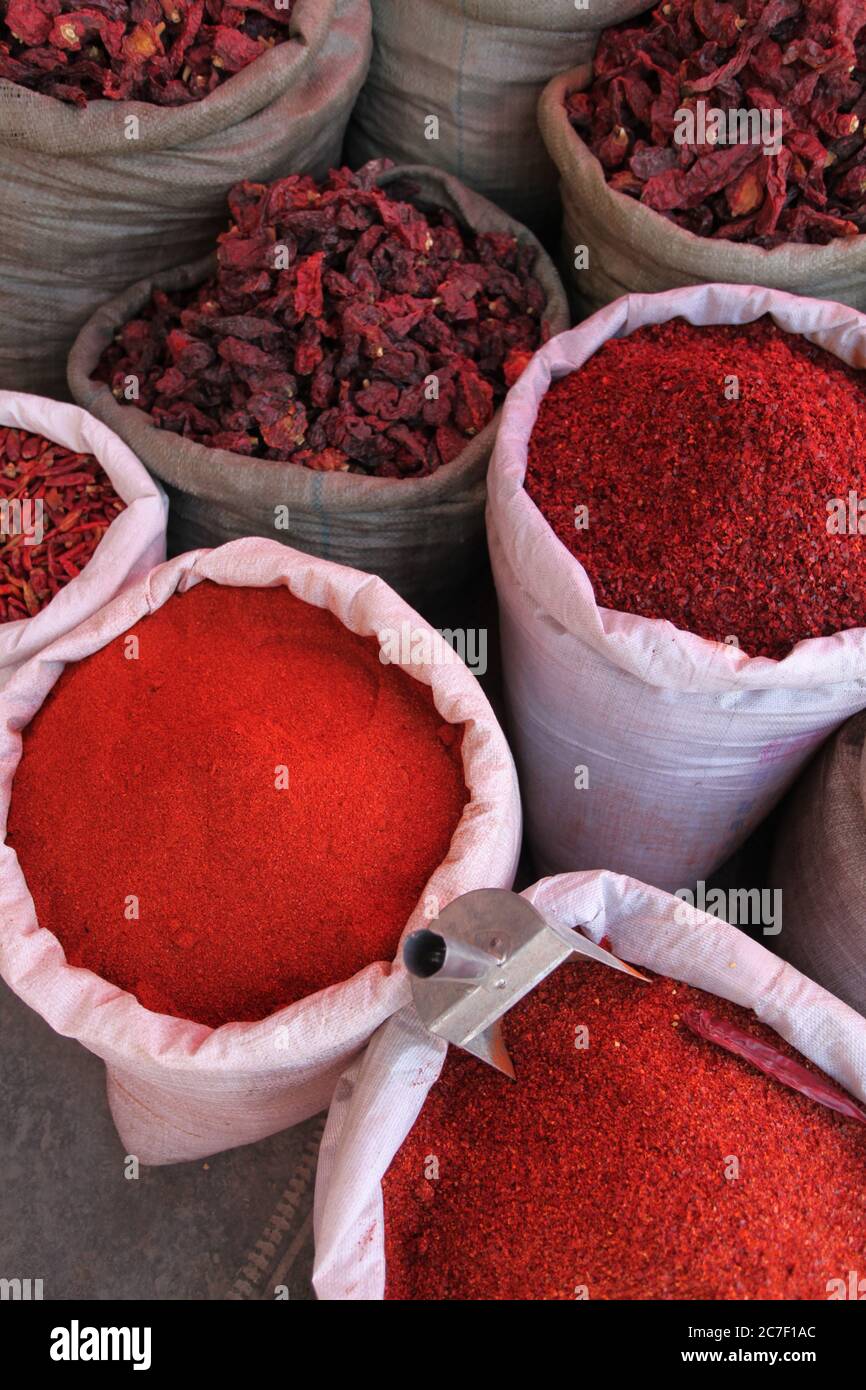 Vertical high angle shot of paprika and pink peppercorn in the market