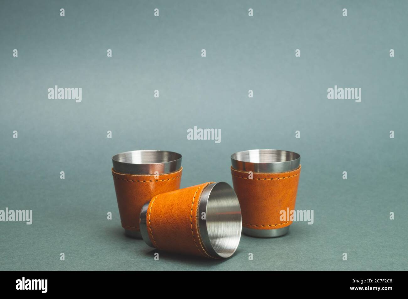 Metallic shot glasses. travel shot glass for alcohol with leather casing  over the stainless steel. personal accessory set. copy space Stock Photo -  Alamy