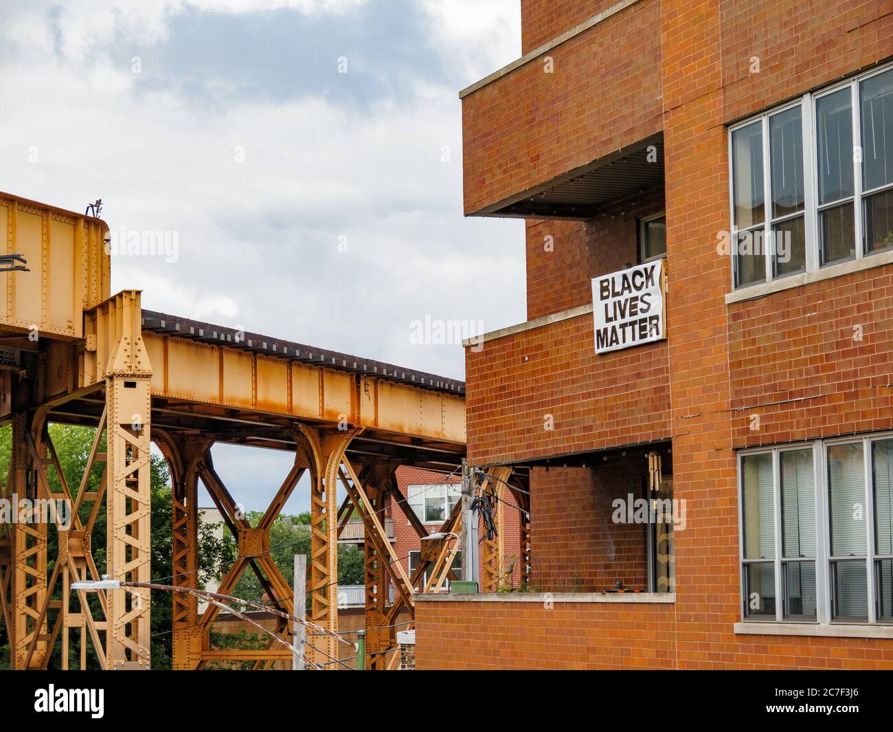 Black Lives Matter sign hanging from apartment terrace, Bloomingdale Trail, Chicago, Illinois. Stock Photo