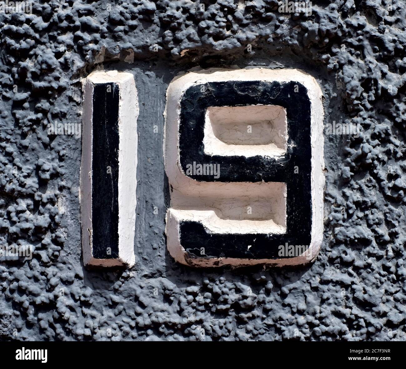 19, number nineteen, black numerals on gray background. Stock Photo