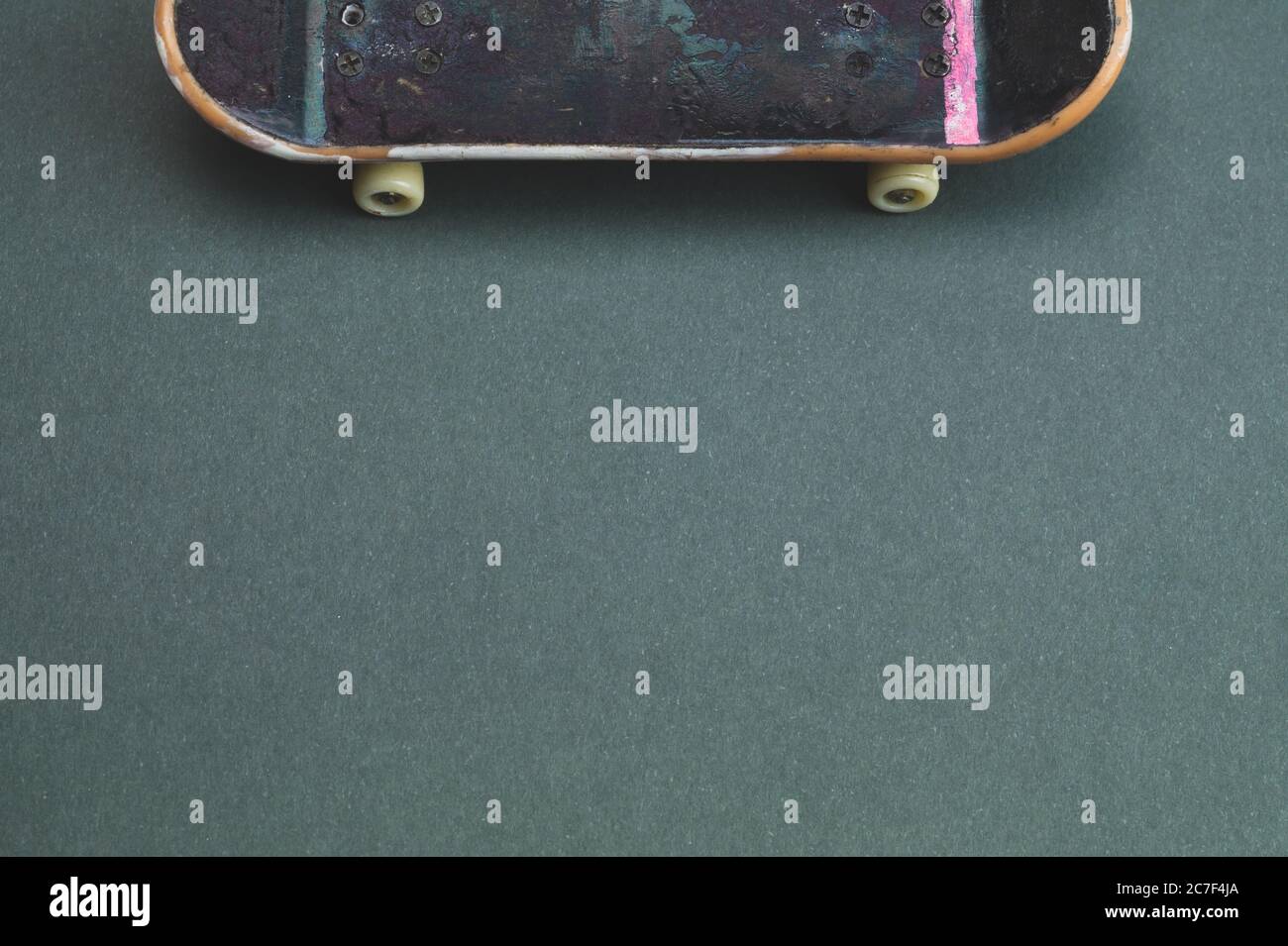 Small skateboard on color background. tiny skate for fingers. fingerboard  close up. copy space Stock Photo - Alamy
