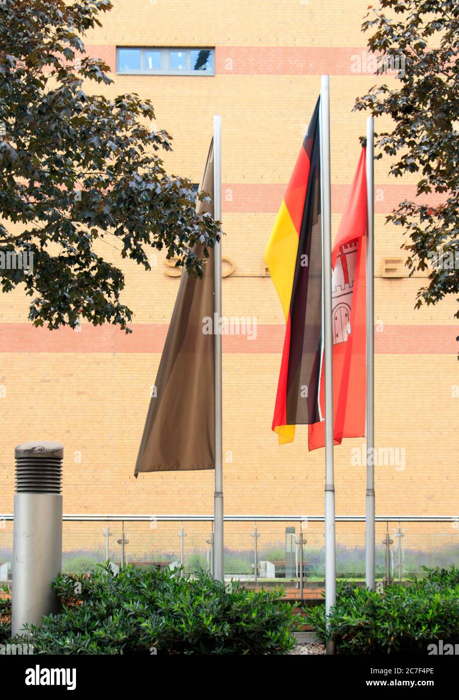 German Flag Inversion Vertical shot of the German flag placed between two other flags Stock ...