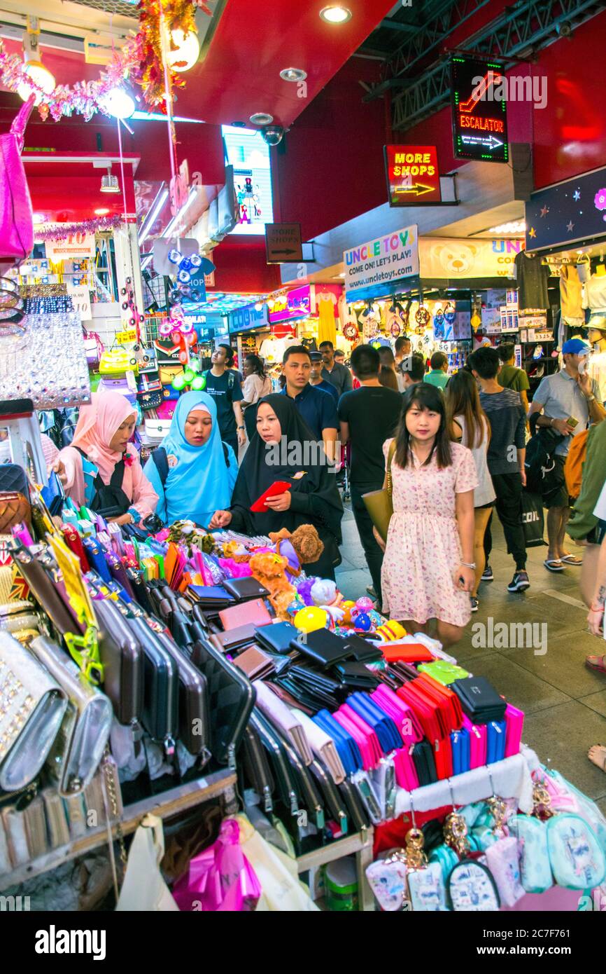 tourists and locals in bugis street market,biggest market in singapore