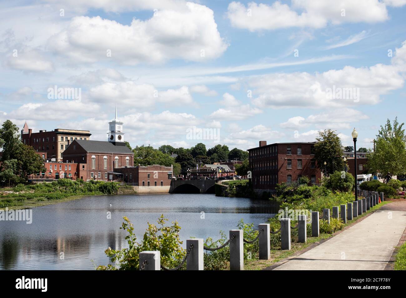 Looking toward Main Street across the Nashua River from the French Renaissance park on Water Street in downtown Nashua, New Hampshire, USA. Stock Photo