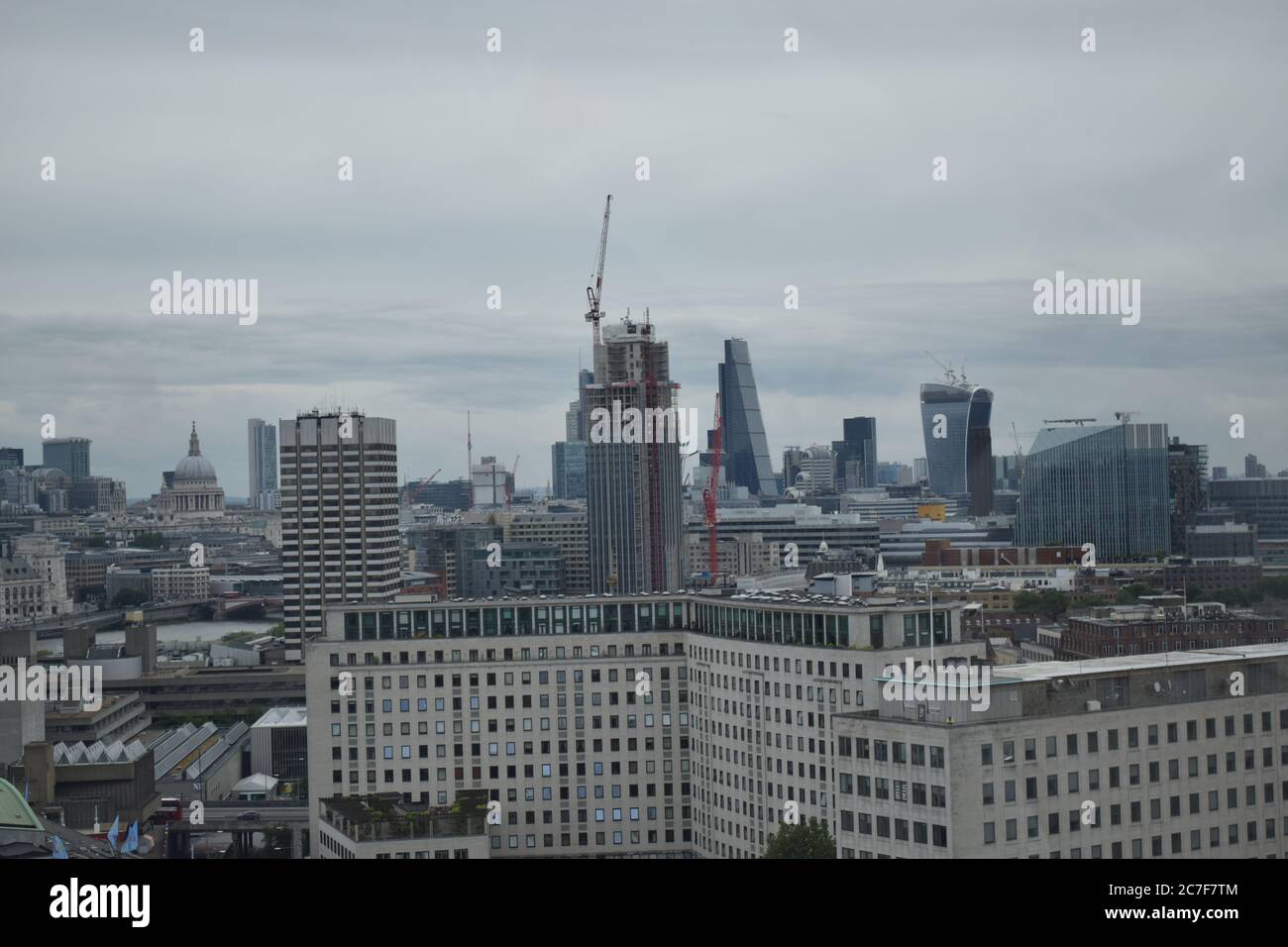 High angle shot of the buildings in London, the UK on a dark cloudy day Stock Photo