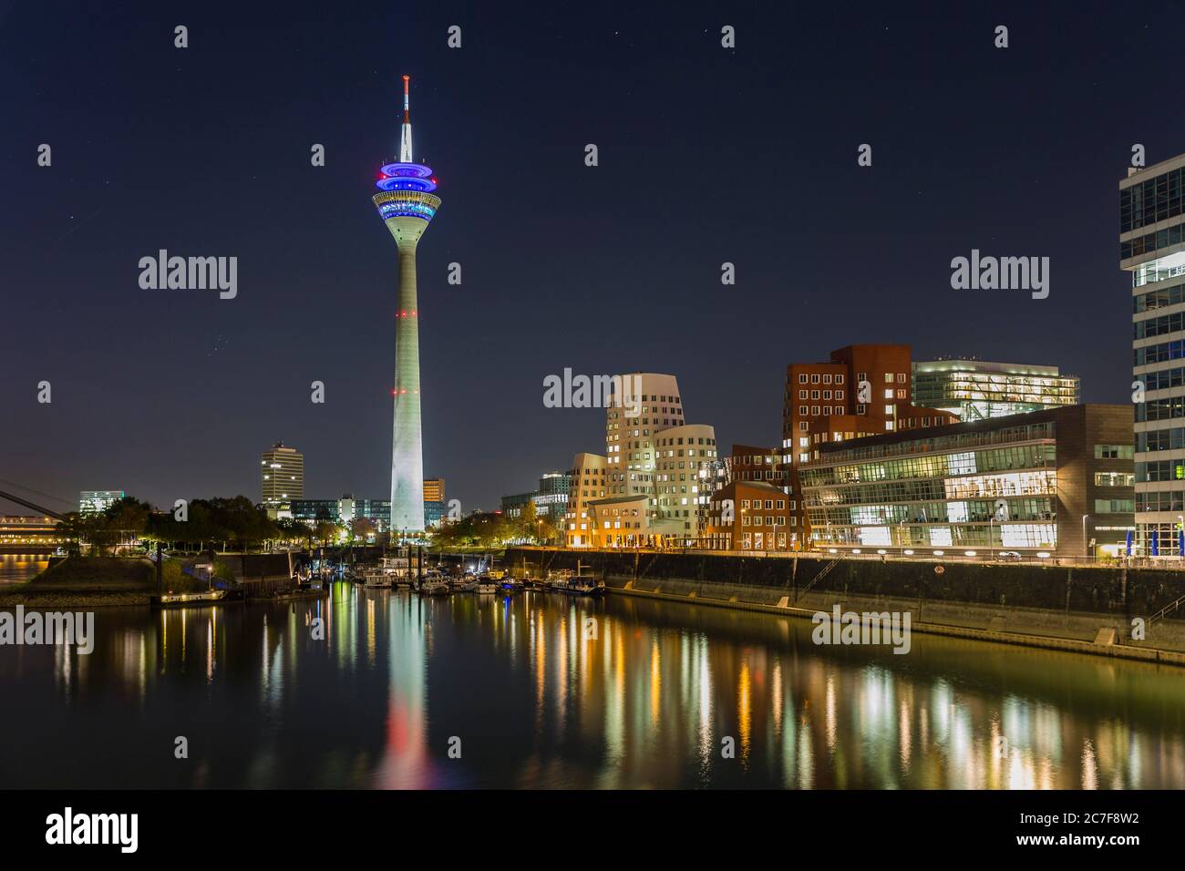 Night shot, marina in the Media Harbour, Rhine Tower, Gehry Bauten, Duesseldorf, North Rhine-Westphalia, Germany Stock Photo