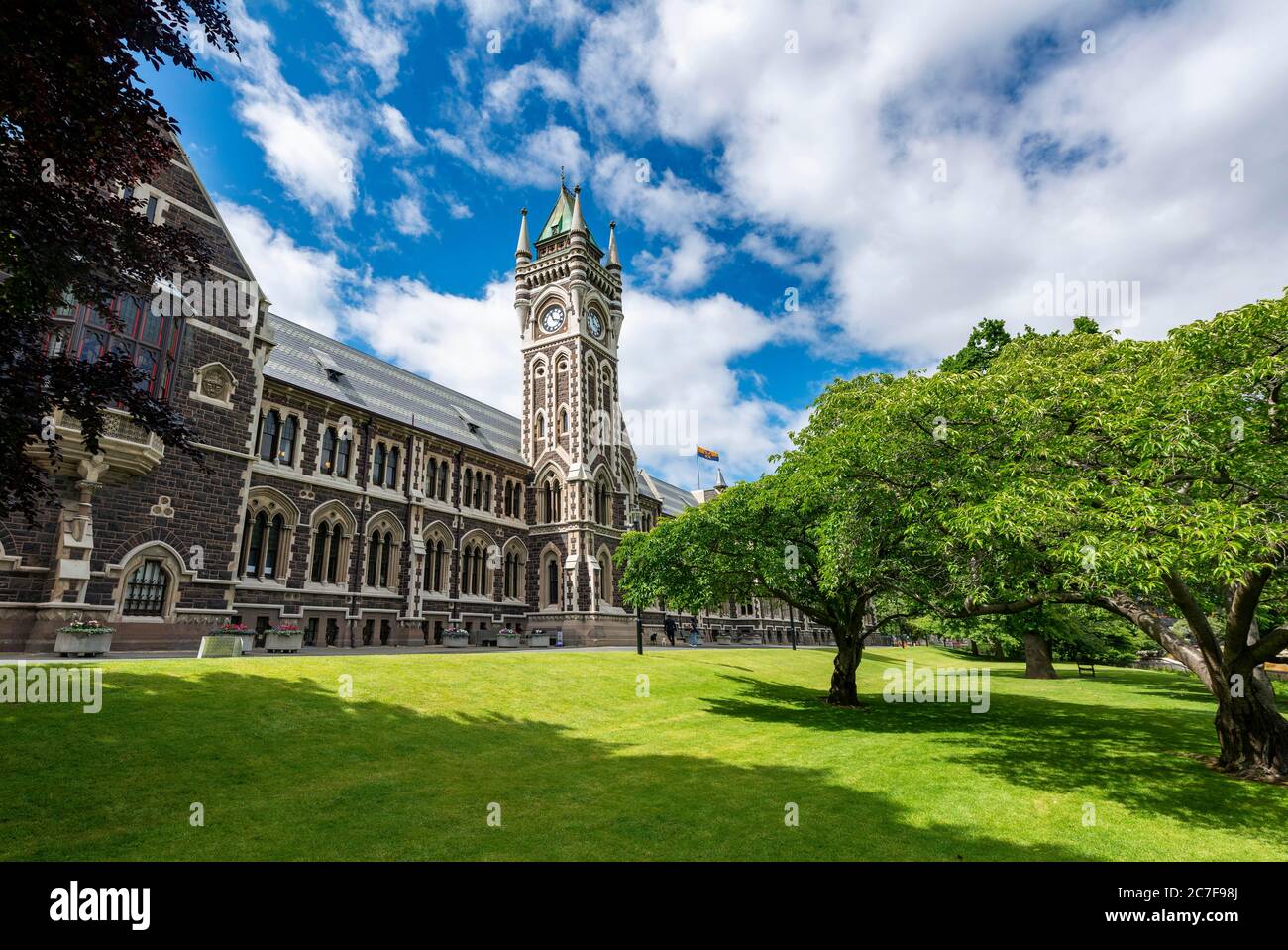 Old neo-gothic main building with bell tower, University of Otago, Dunedin, Otago region, New Zealand Stock Photo