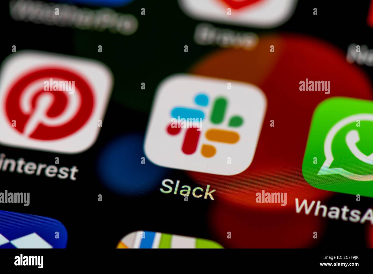 Slack Icon, App Icons on a mobile phone display, iPhone, Smartphone, close-up Stock Photo