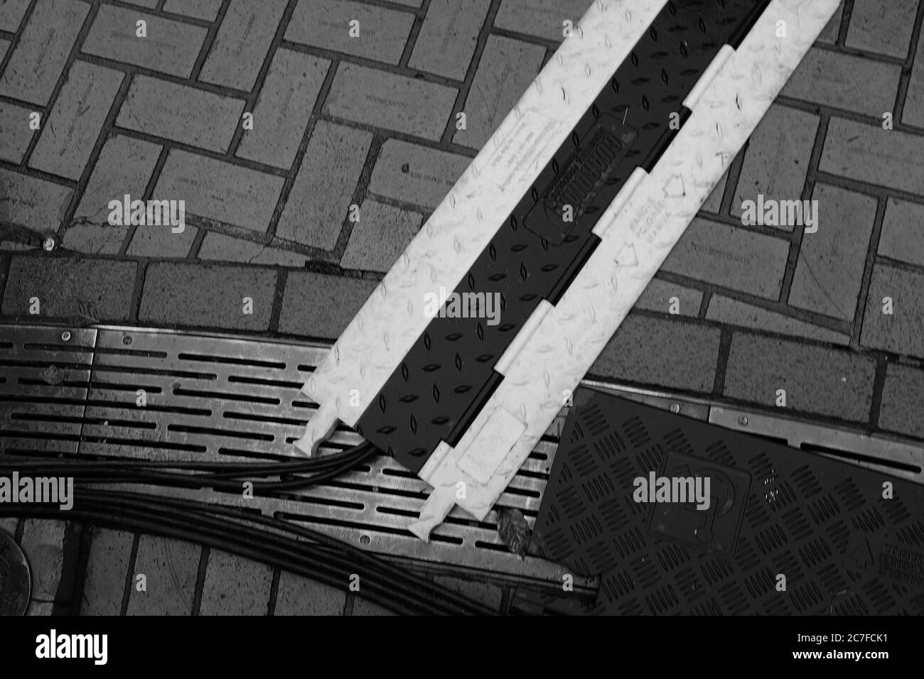 PORTLAND, UNITED STATES - Dec 14, 2019: A high angle greyscale shot of wires on the ground in Portland, United States Stock Photo