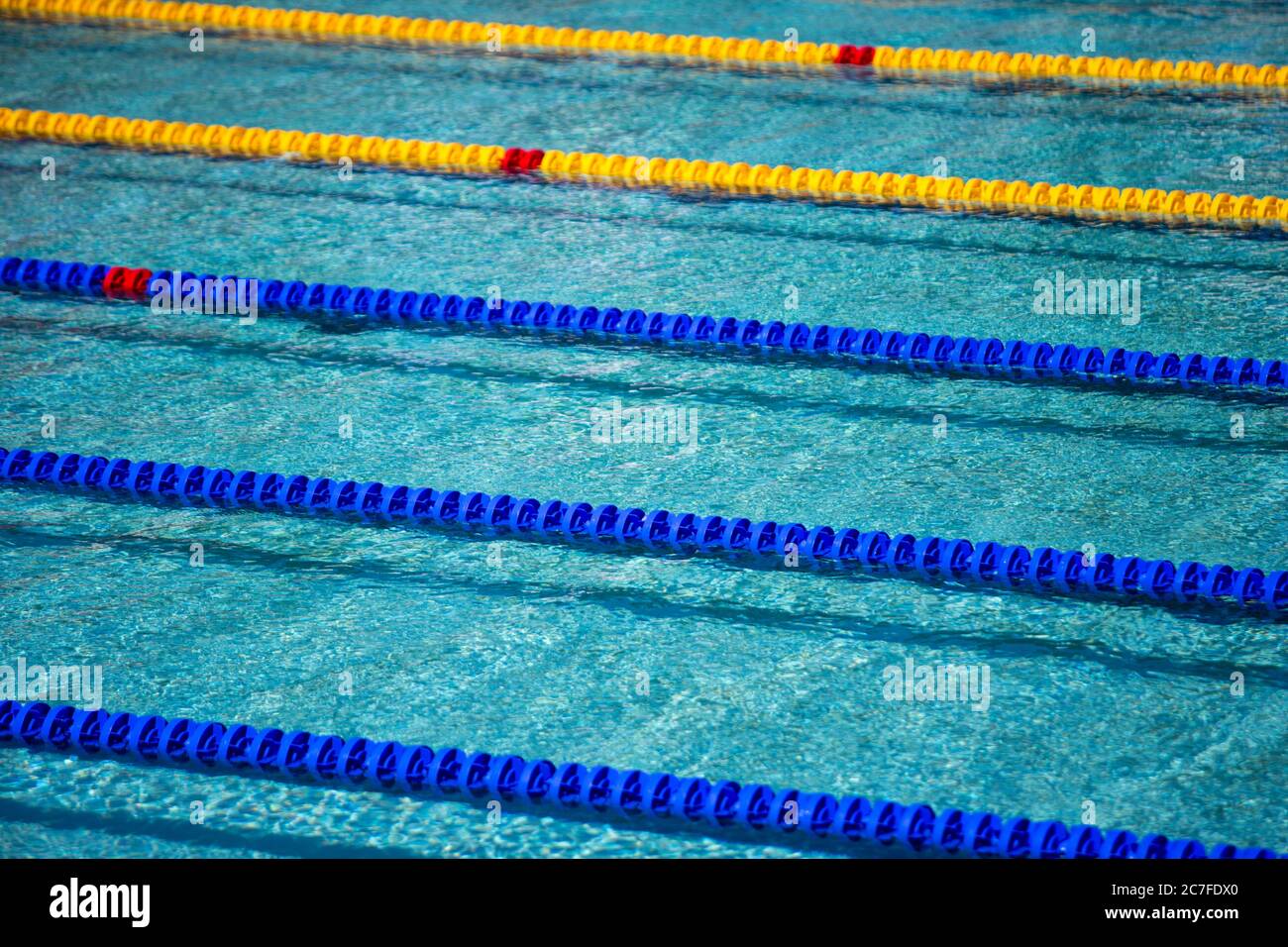 Swimming pool with blue and yellow ropes ready for a swimming
