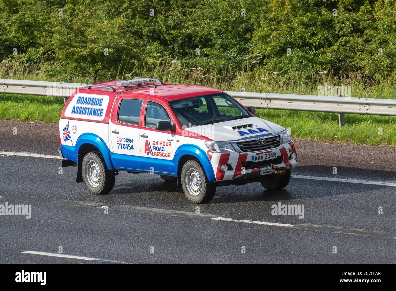 AAA Roadside assistance; Vehicular traffic moving vehicles, commercial vans,  panel van, 2017 Toyota Hilux Active D-4d 4X4 DCB business vehicle, van  driving vehicle on UK roads, motors, motoring on the M6 motorway