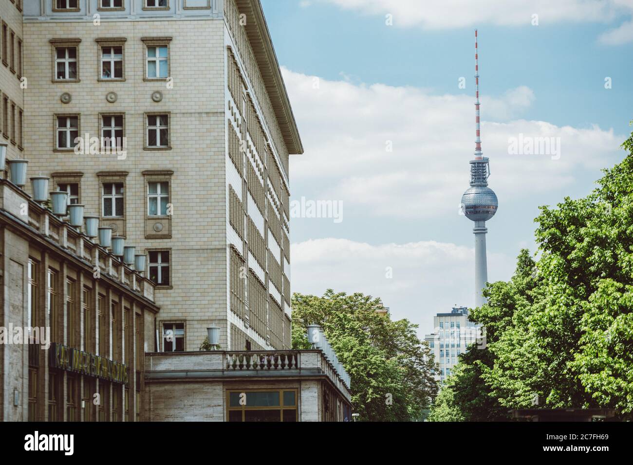 Street view of east Berlin tourist attraction Fernsehturm known as Pope’s Revenge during the sunny spring day Stock Photo