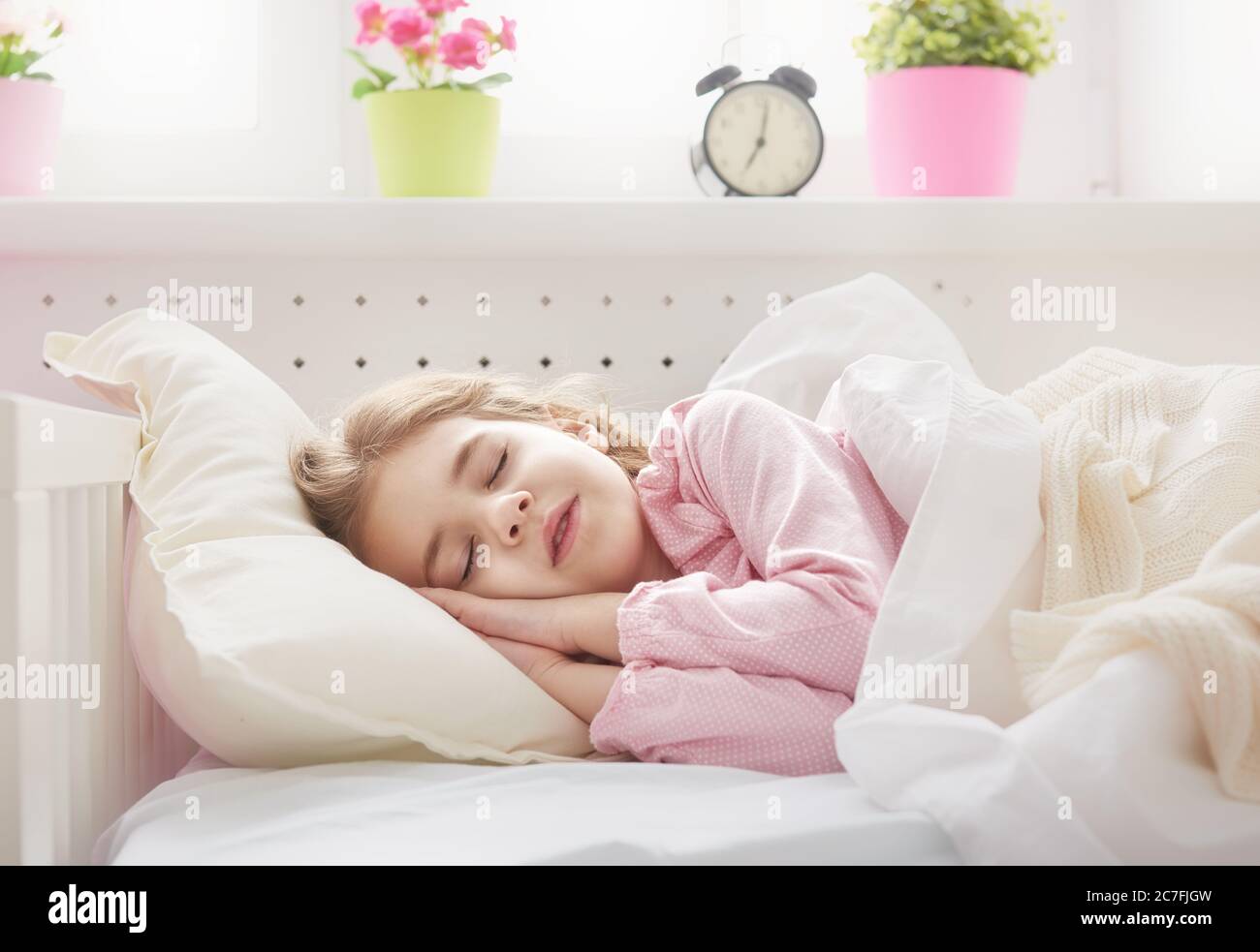 Adorable little child girl sleeping in the bed Stock Photo - Alamy