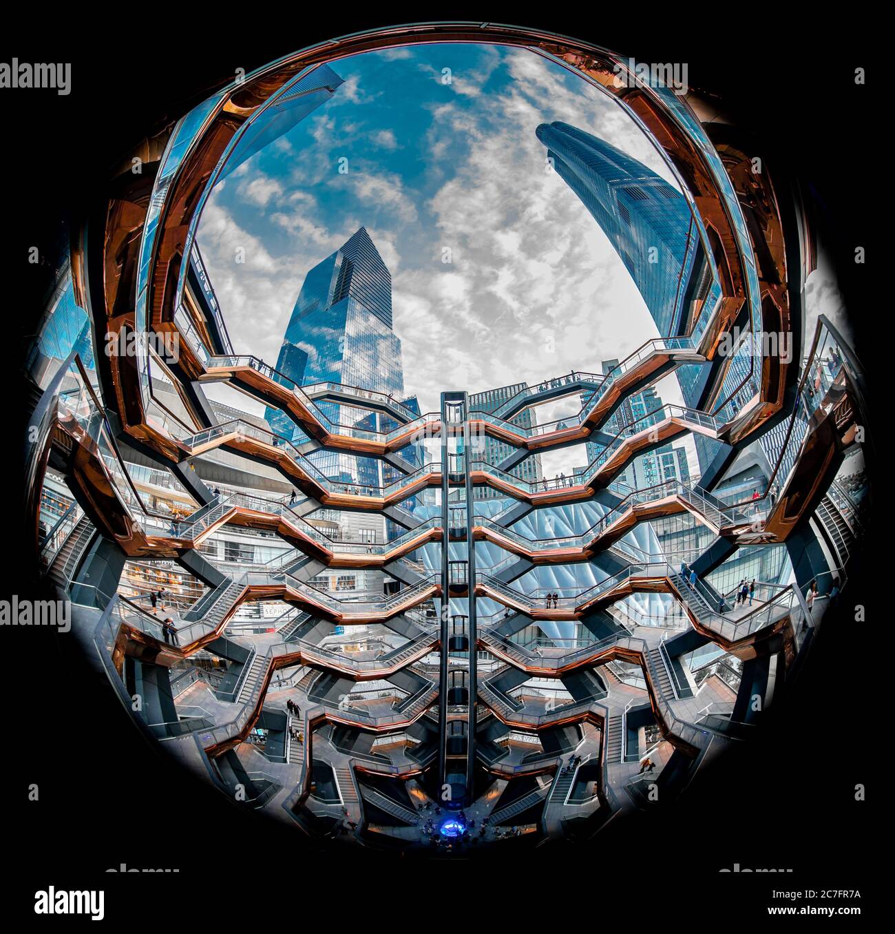 Low angle fish eye shot of a fence with tall skyscrapers and white ...