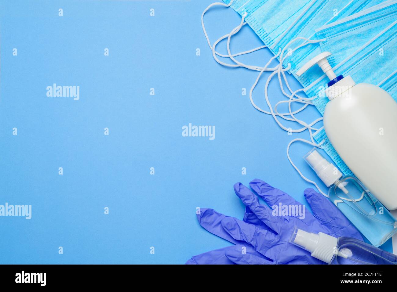 flat layout of hygiene items - latex gloves, mask and hand sanitizer ...
