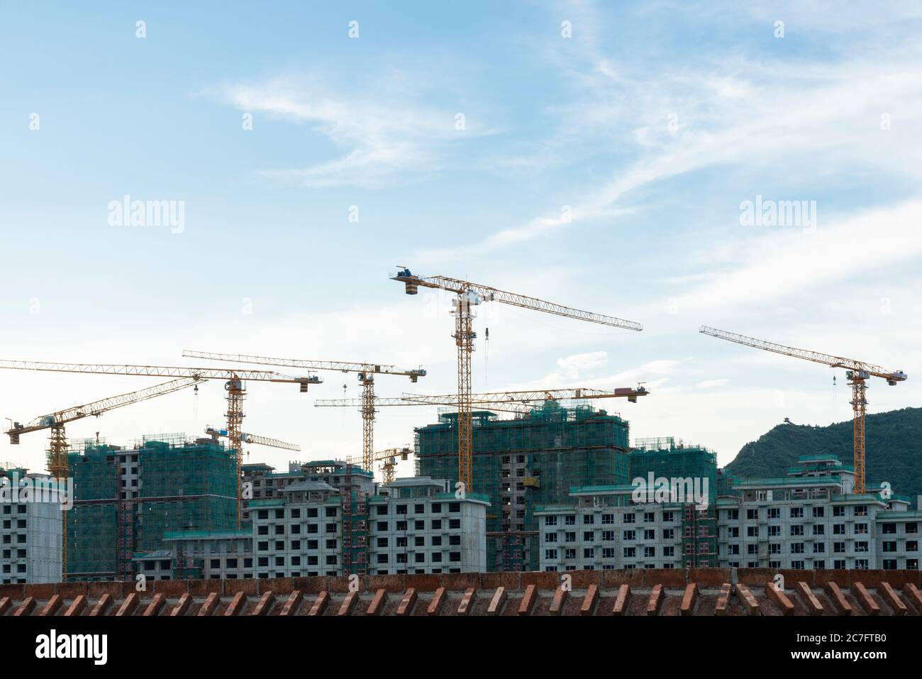 Residential area under blue sky and white clouds Stock Photo - Alamy