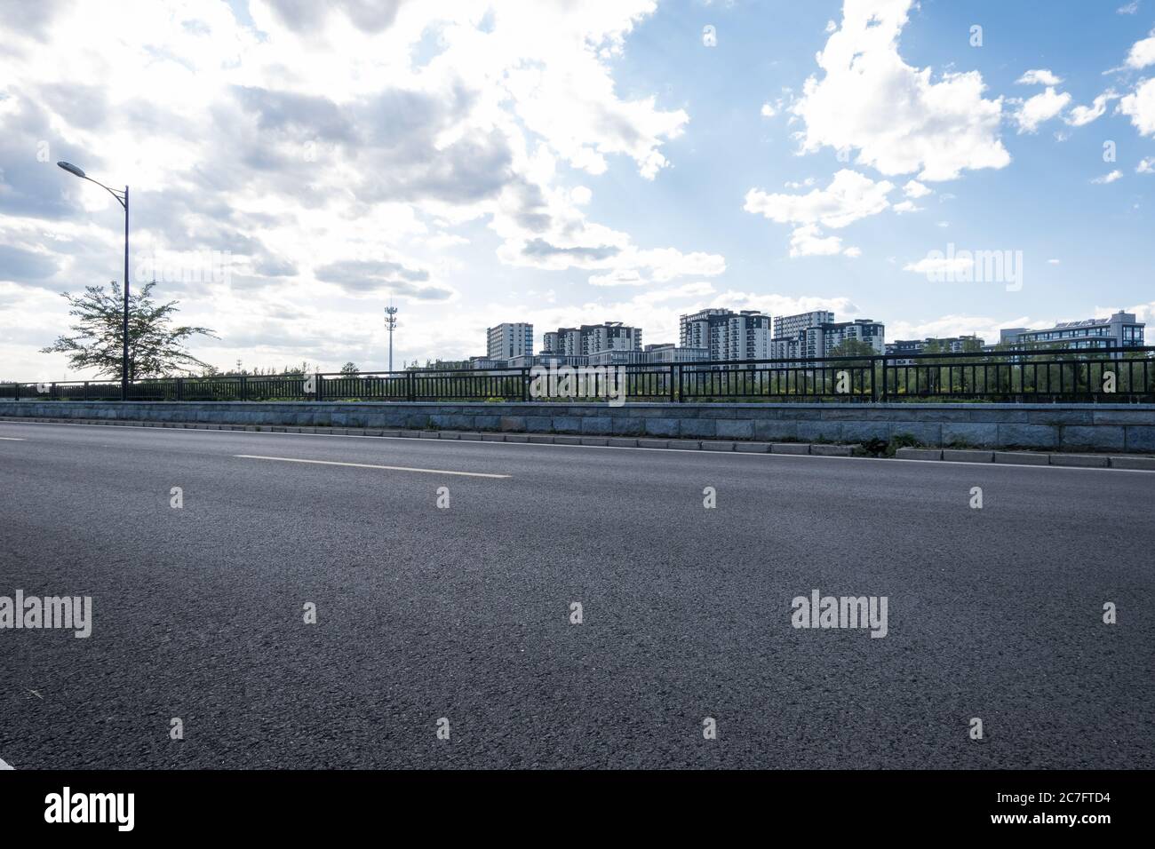 Residential area under blue sky and white clouds Stock Photo - Alamy