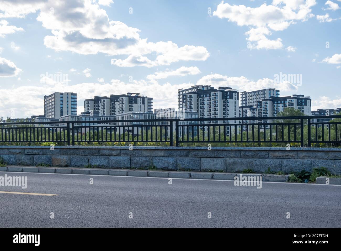 Residential area under blue sky and white clouds Stock Photo - Alamy