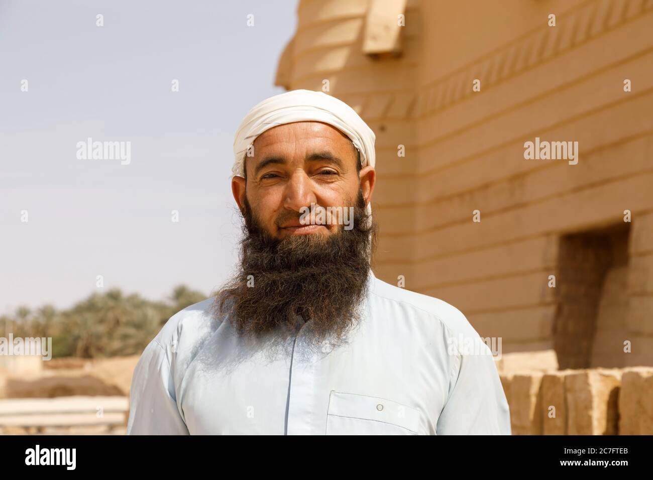 Raghba, Saudi Arabia, February 16 2020: A Muslim construction worker in Saudi Arabia with a traditional beard poses on his construction site. Stock Photo