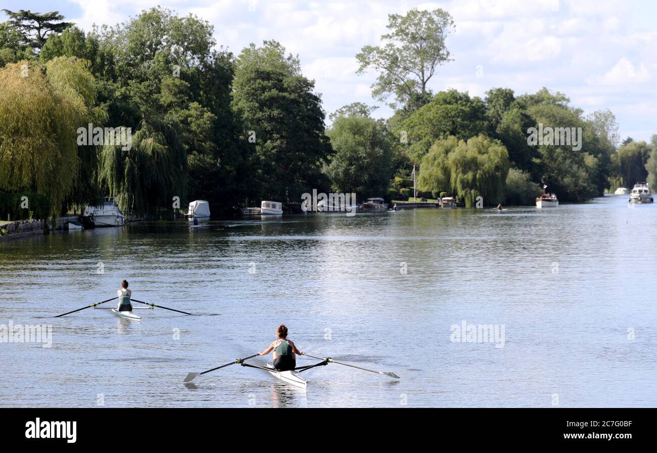 Two rowers from Maidenhead Rowing Club make their way along the River Thames from Bray to Maidenhead, Berkshire. Stock Photo