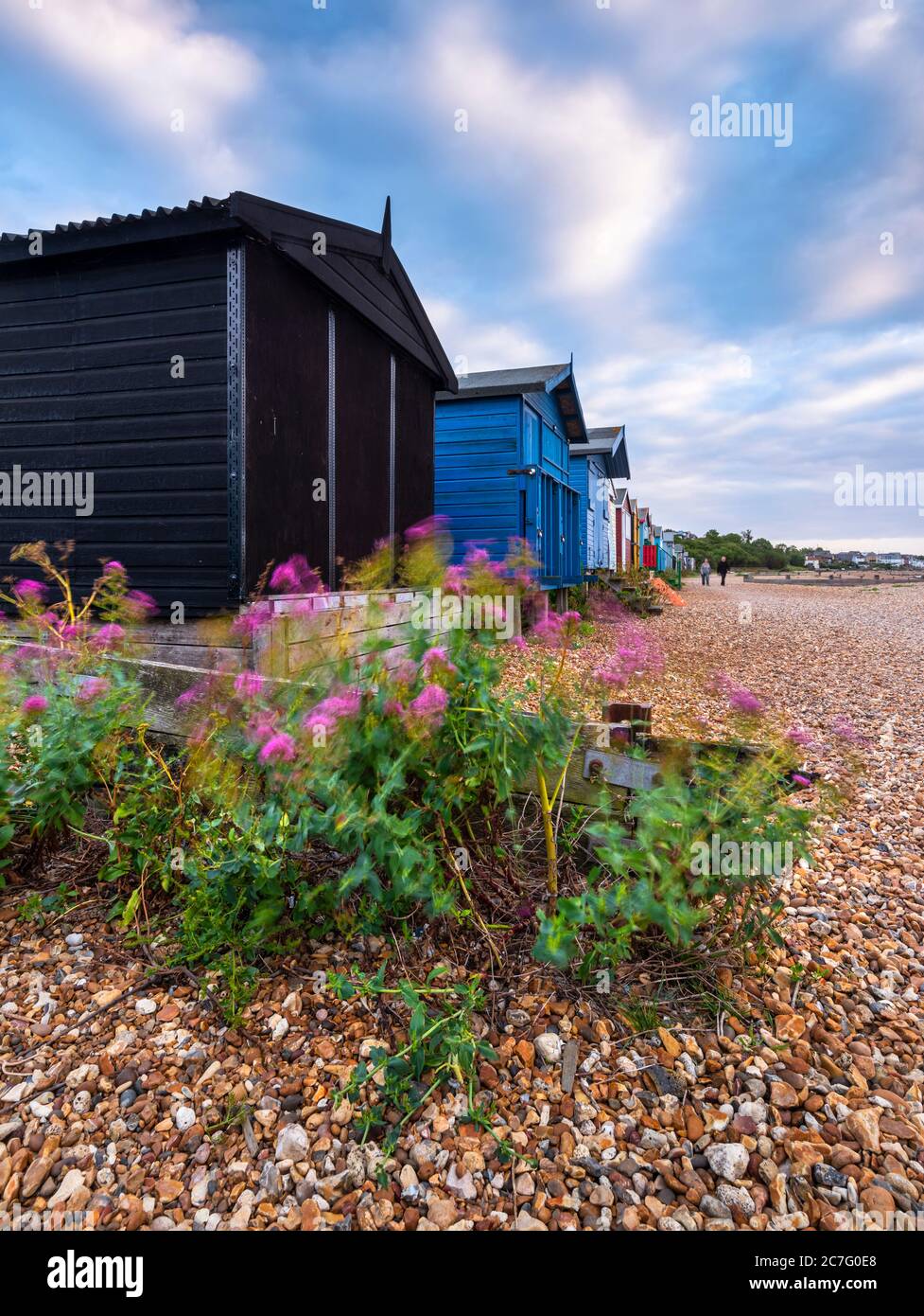 Traditional wooden beach huts on West Beach in Whitstable, Kent Stock Photo