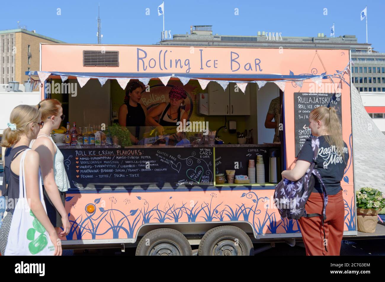 People waiting near rolling ice bar in Helsinki, Finland Stock Photo