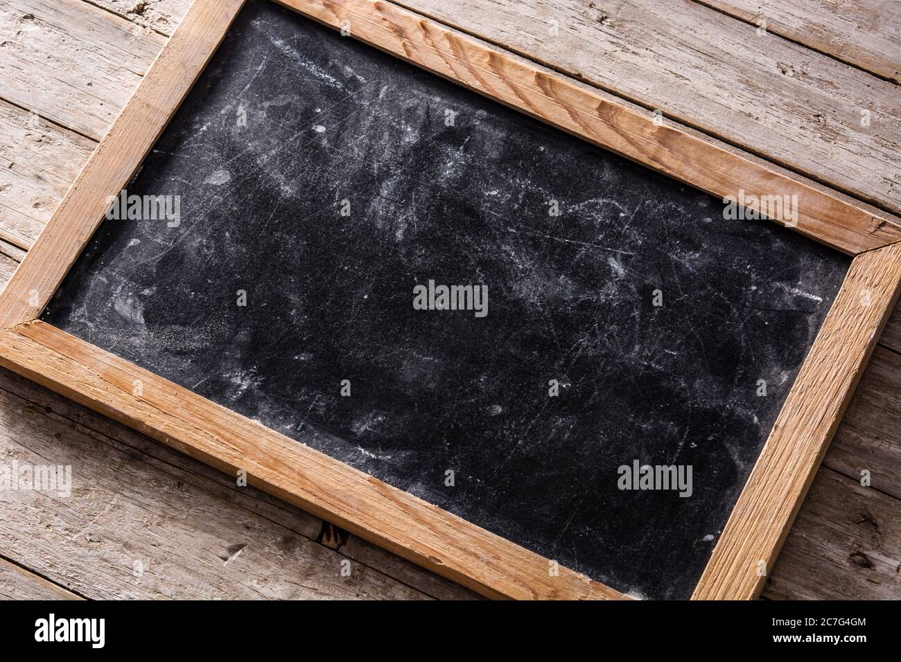 Blackboard on wooden background Stock Photo