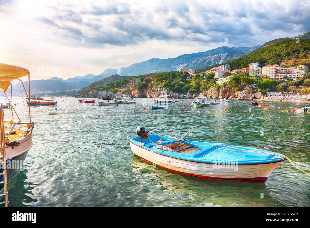 Picturesque summer view of Adriatic sea coast in Budva Riviera near Przno village with lots of boats in the sea. Location: Przno village, Montenegro, Stock Photo