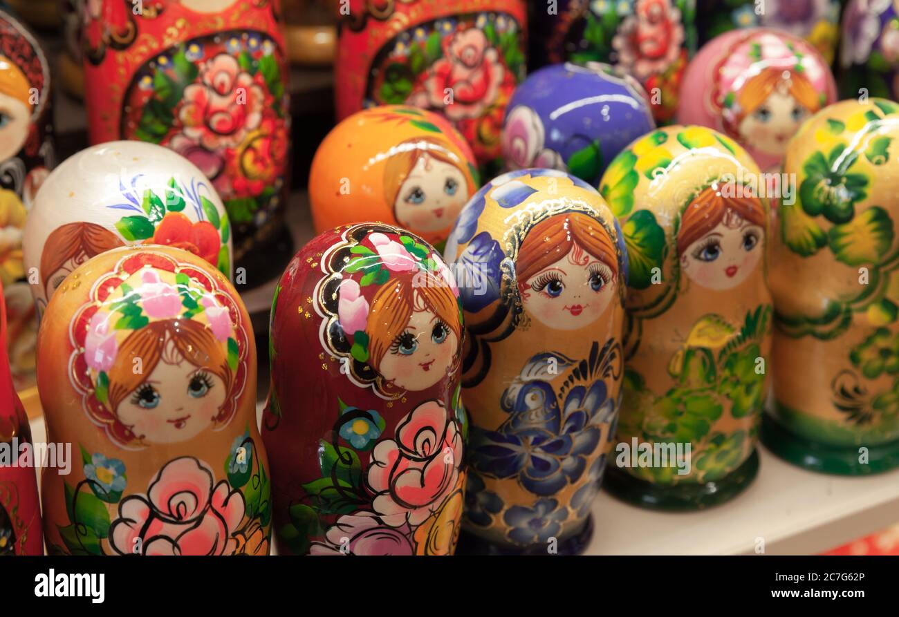 Matryoshka dolls, also known as a Russian nesting dolls are on a counter of a gift shop. Popular souvenir Stock Photo