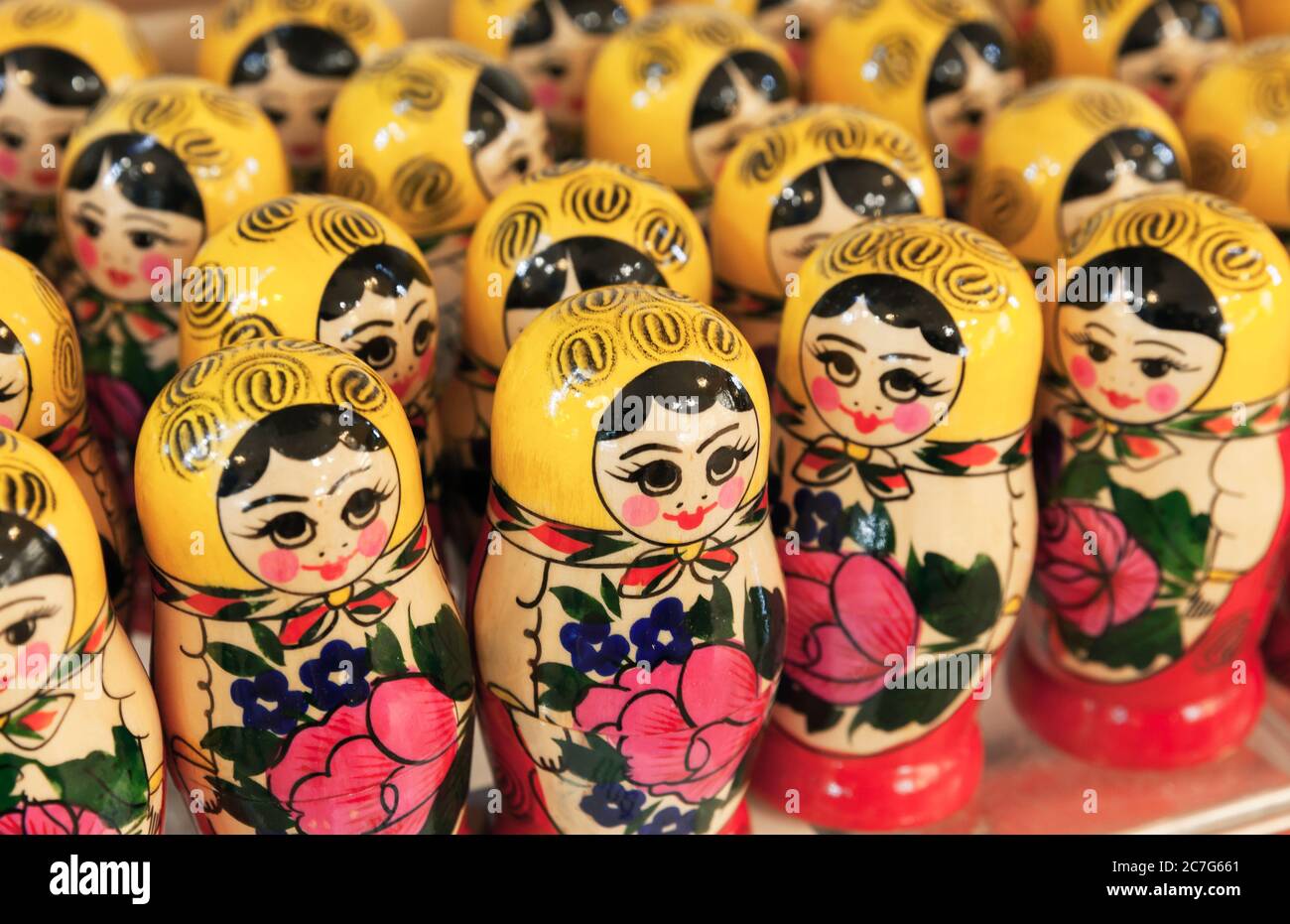 Colorful wooden Matryoshka dolls, also known as a Russian nesting dolls are on a counter of a gift shop. Popular souvenir Stock Photo