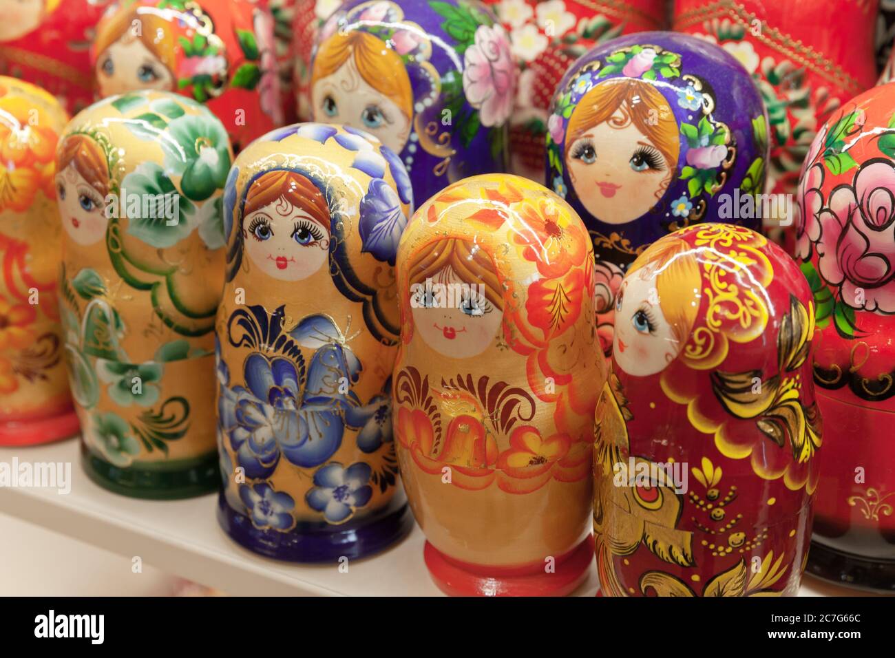 Colorful Matryoshka dolls, also known as a Russian nesting dolls are on a counter of a gift shop. Popular souvenir Stock Photo