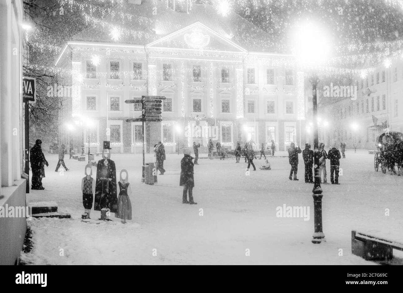 TARTU, ESTONIA - Dec 24, 2014: Tartu Town Hall Square on a Christmas Eve during heavy snowfall Stock Photo