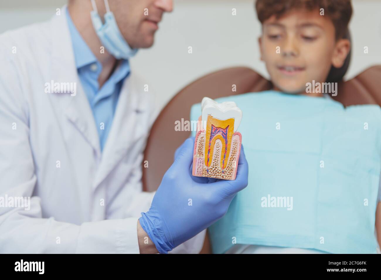 Cropped shot of a professional dentist explaining dental care to a