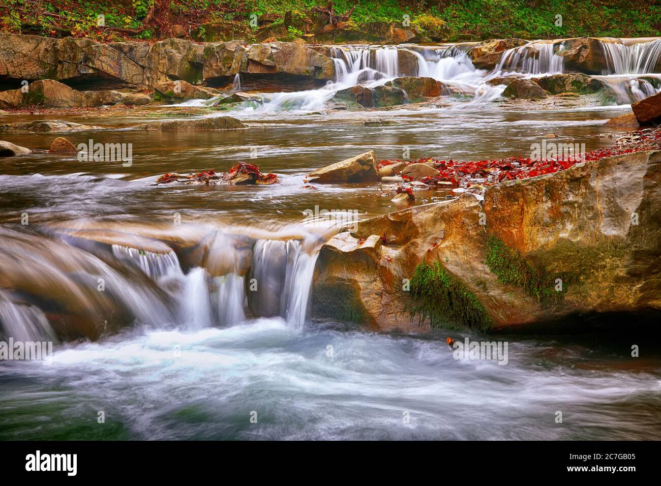 Fallen tree in waterfall hi-res stock photography and images - Alamy
