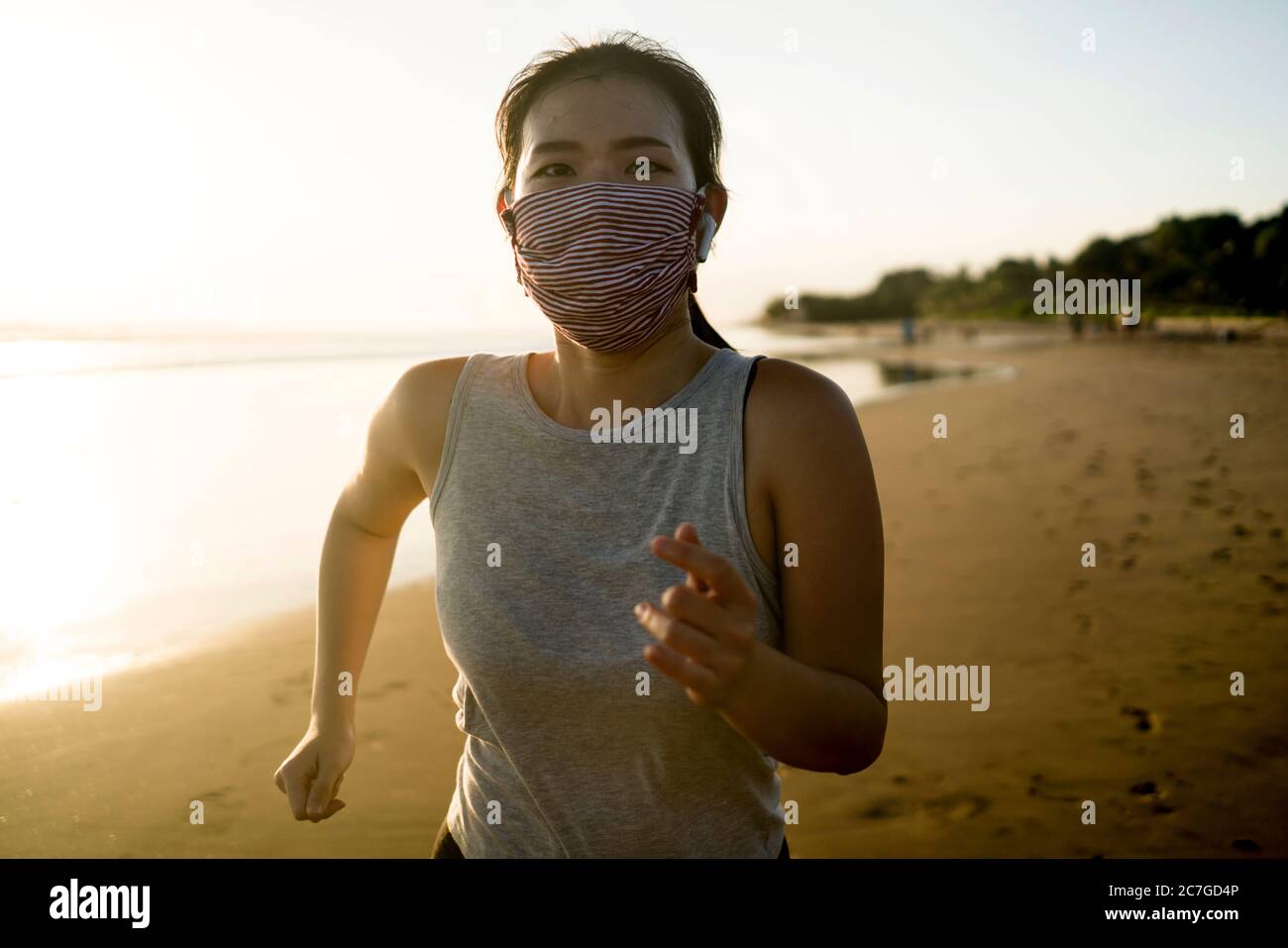 new normal running workout of Asian girl in face mask young happy and