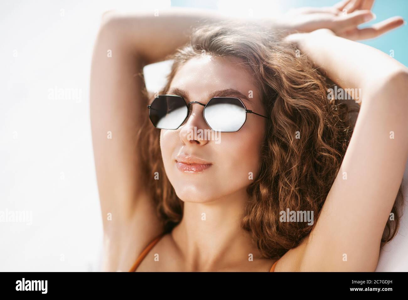 Face of young girl sunbathing under the sun Stock Photo Alamy