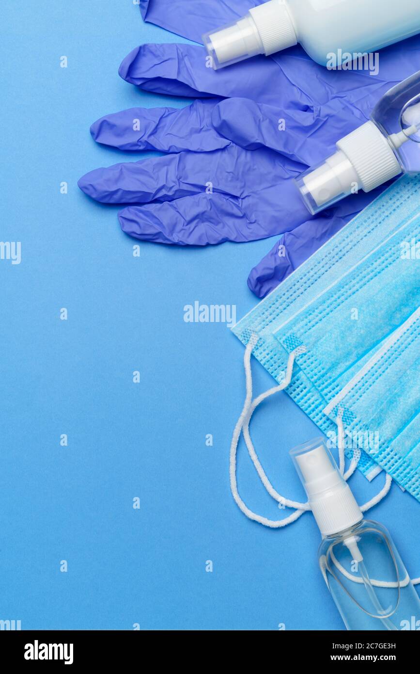 bottle of lotion, sanitizer or liquid soap, latex rubber gloves, hat