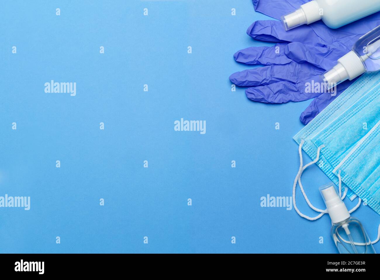 bottle of lotion, sanitizer or liquid soap, latex rubber gloves, hat