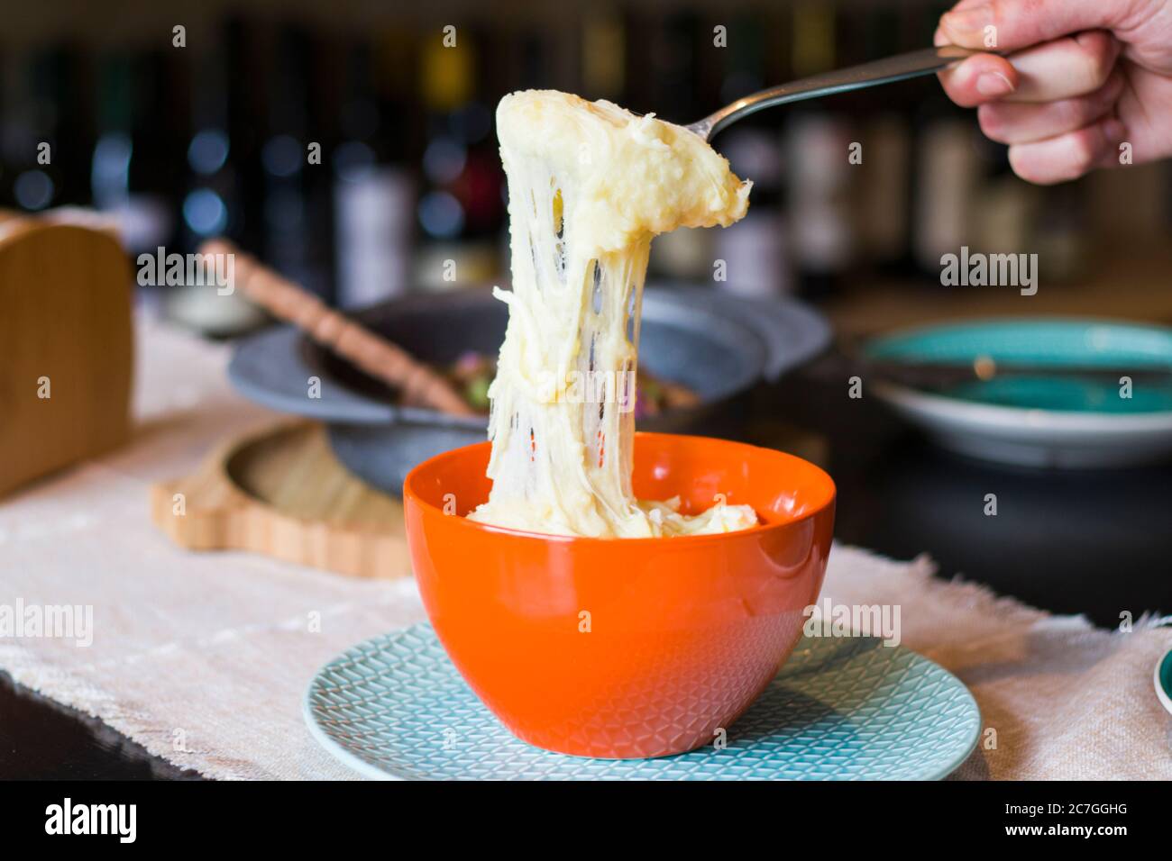 traditional dish with potatoes and cheese, Tashmijabi. Human