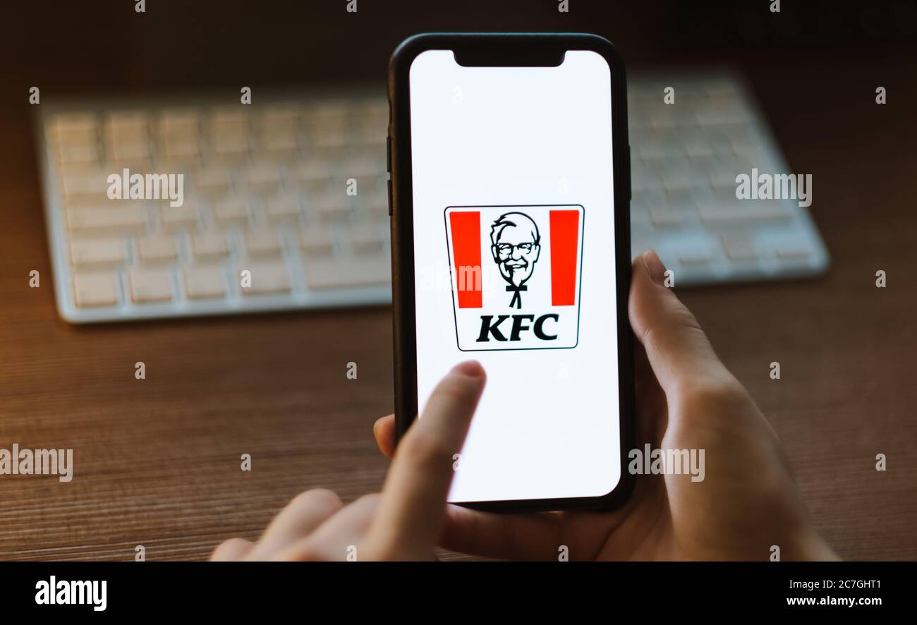 KFC logo on the smartphone screen in hand Stock Photo Alamy