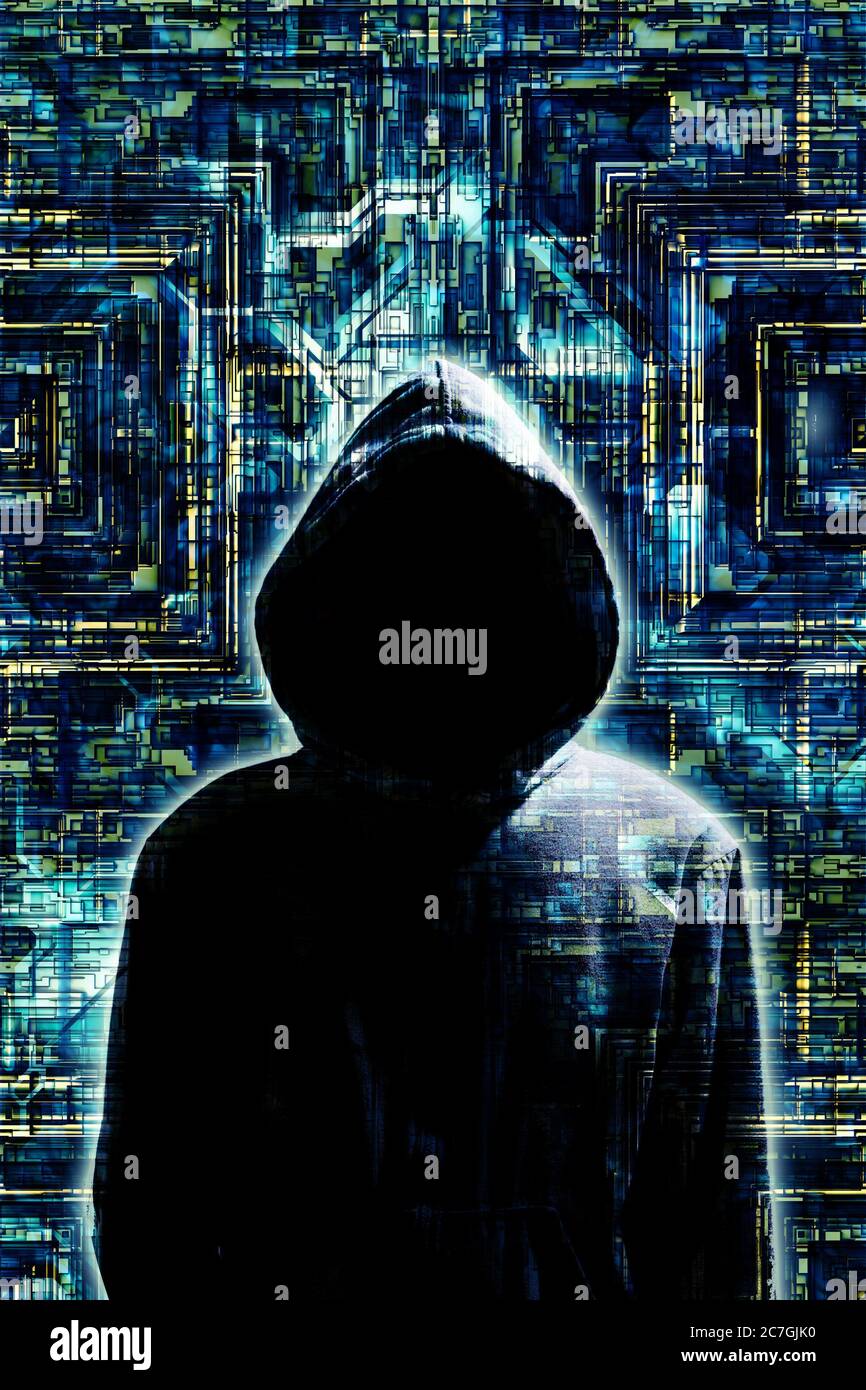 mysterious man in hood as concept for hacker and security issues in the Internet Stock Photo