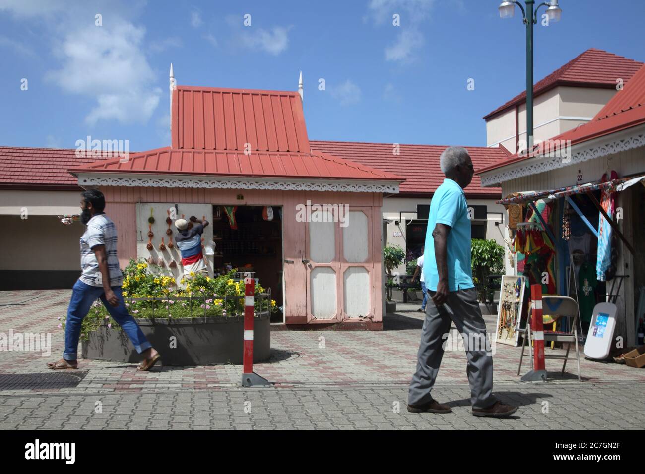 St George's Grenada locals walking by shops near the The Esplanade Mall Stock Photo