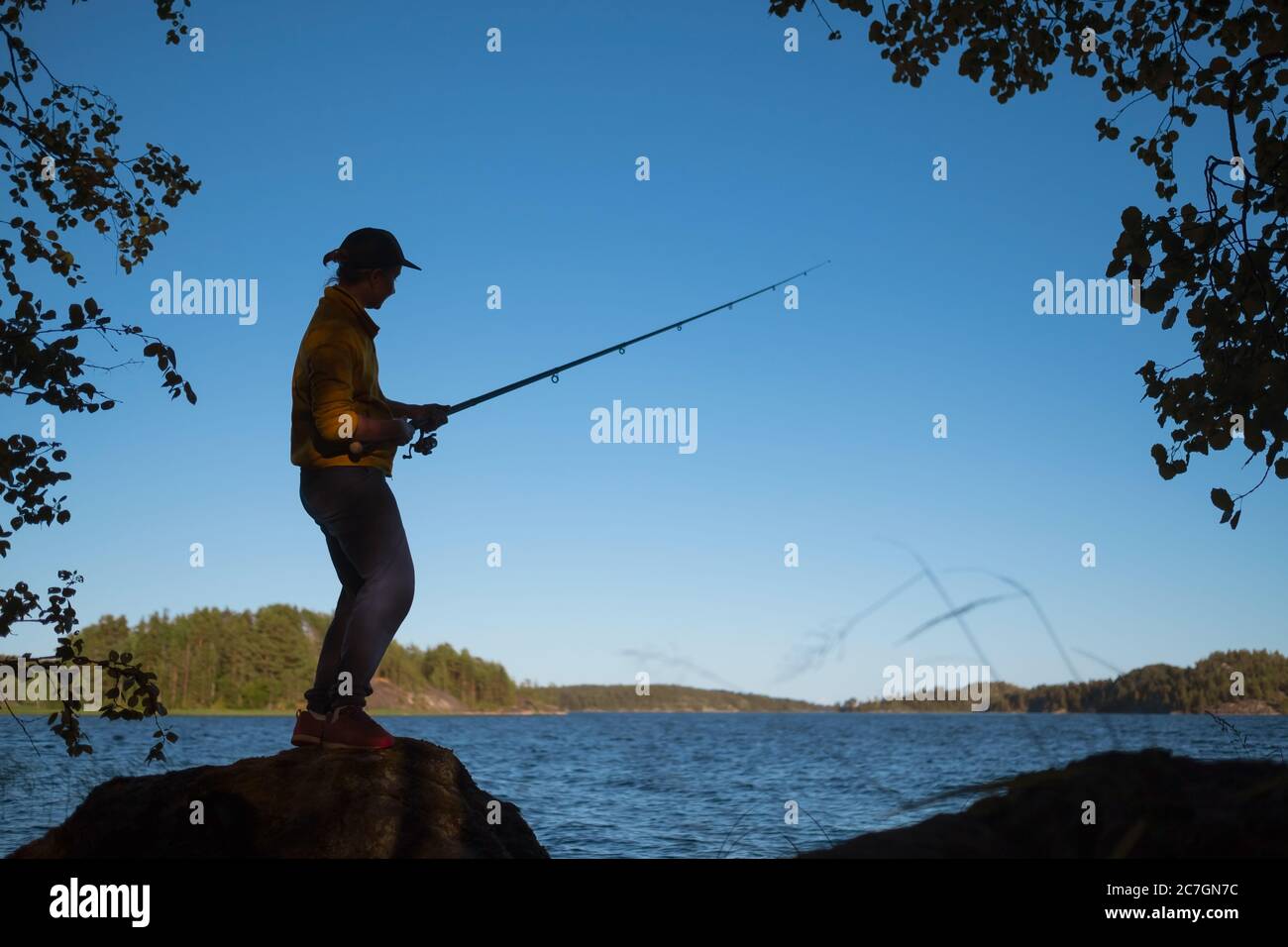 Silhouette woman fishing hi-res stock photography and images - Alamy