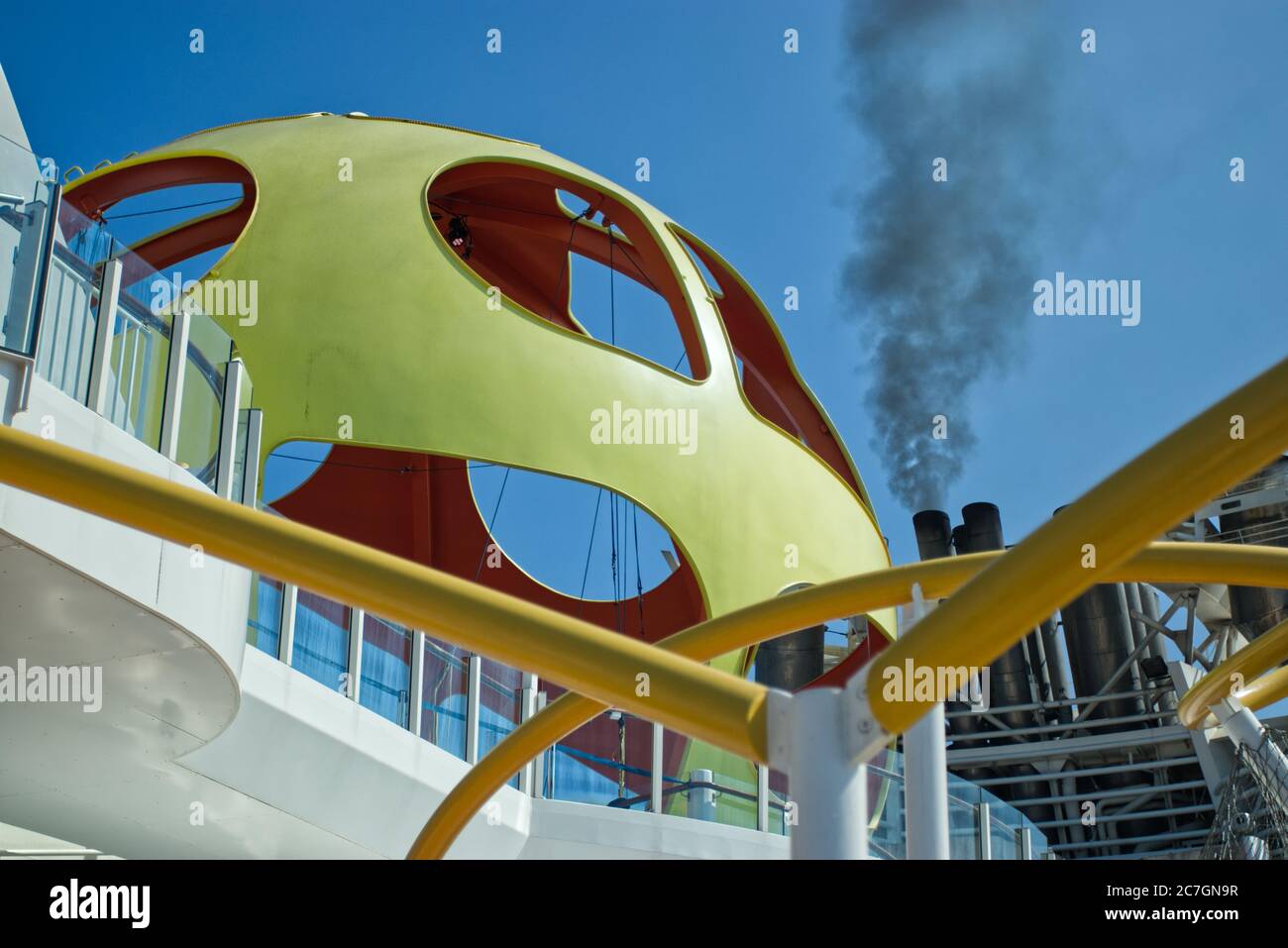 Horizontal shot of black pollution smoke coming out of cruise ship Stock Photo