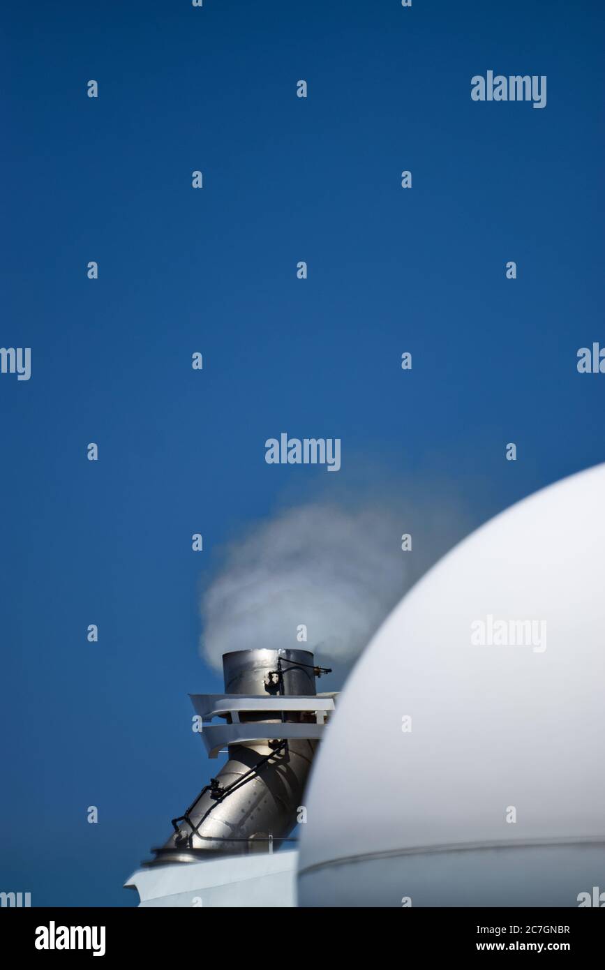 Close up vertical shot of smoke coming out of cruise ship Stock Photo