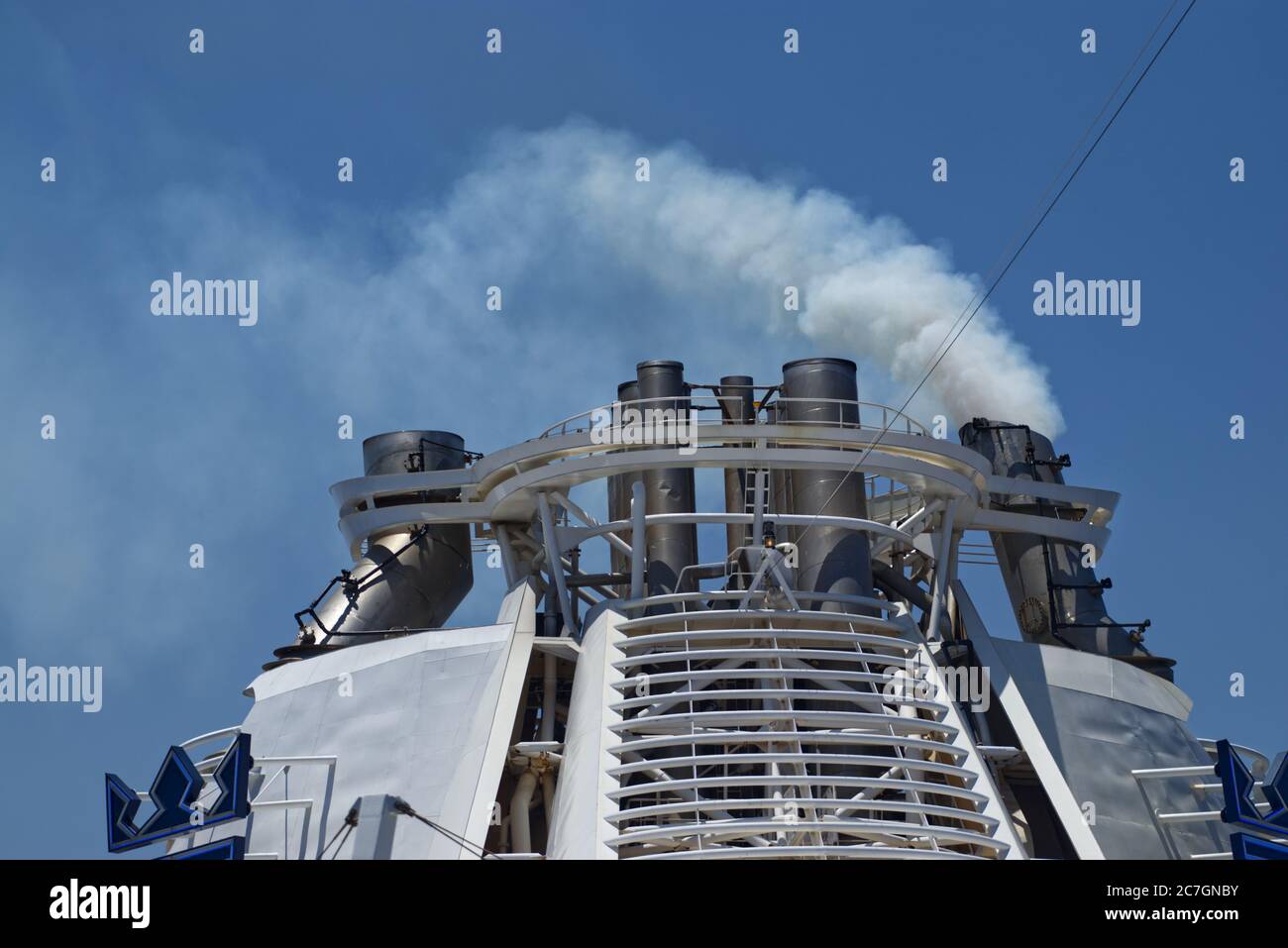 Plums of smokes coming out of cruise ship exhausts Stock Photo